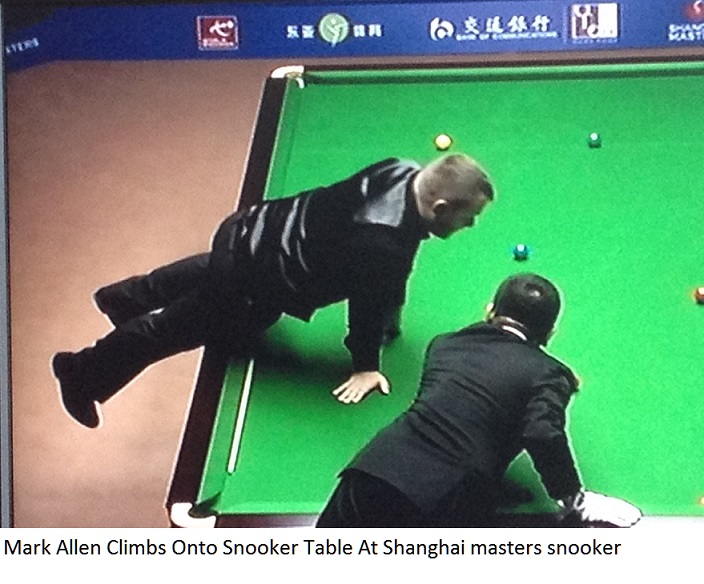 Mark Allen climbs onto snooker table at Shanghai Masters