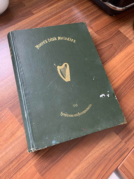 Moore's Irish Melodies front cover of book in green with gold lettering